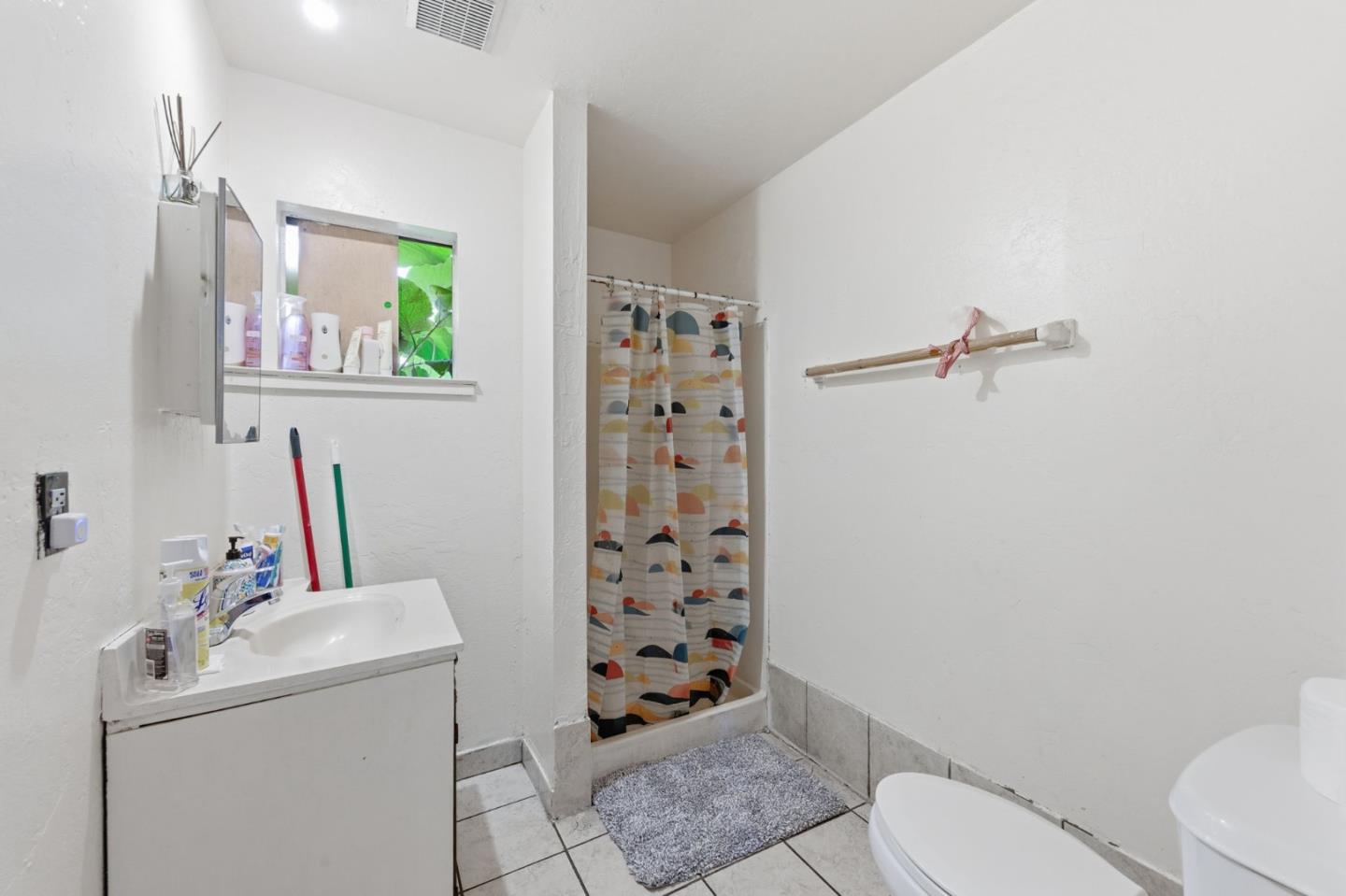 361 North 10th Street San Jose, CA 95112 - Photo 5 of 14 a bathroom with a sink a toilet and shower