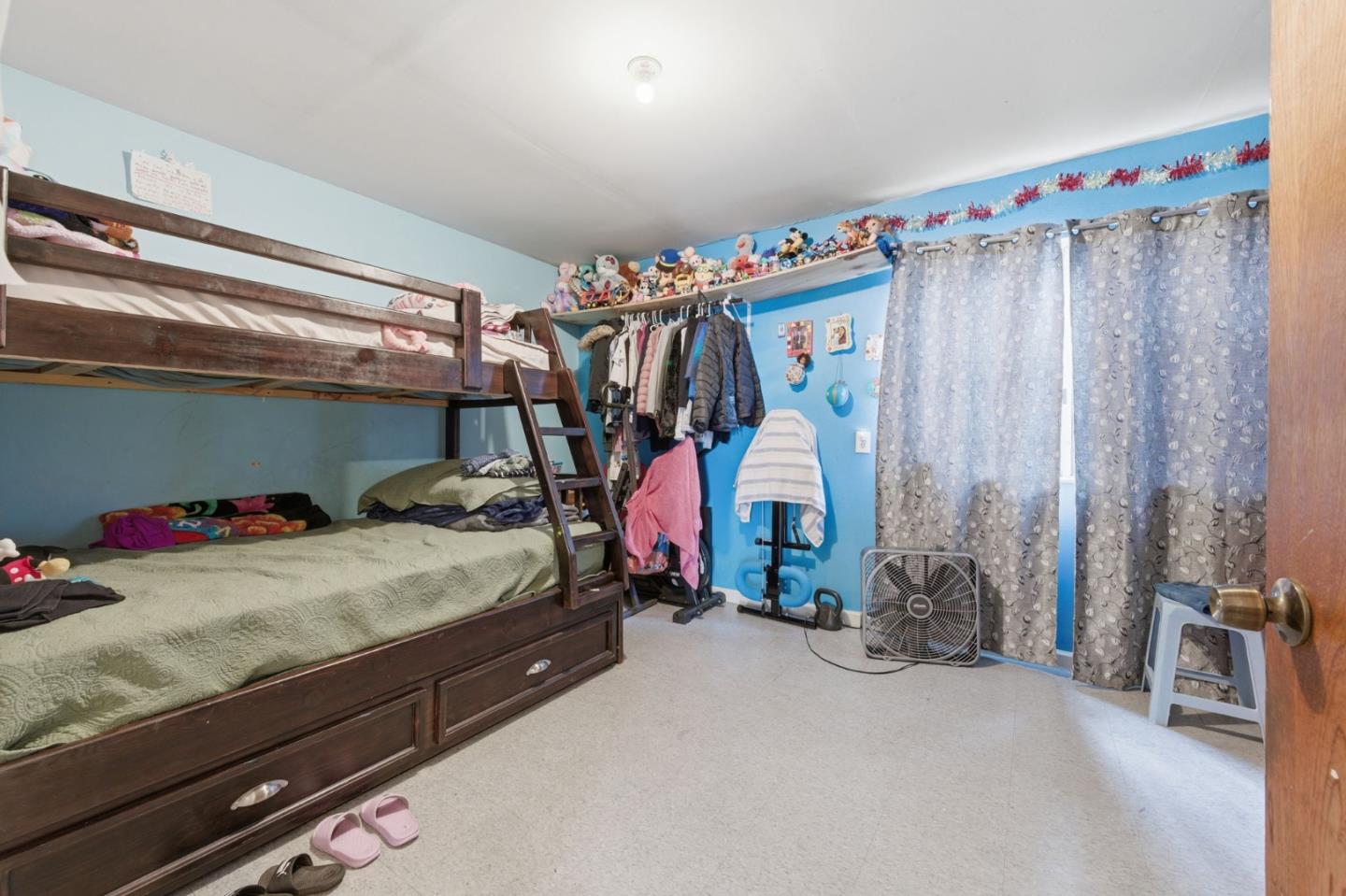 361 North 10th Street San Jose, CA 95112 - Photo 9 of 14 a bed room with a bed and a window