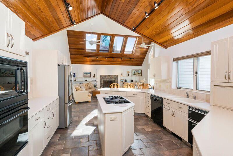 73 Barley Neck Road Orleans, MA 02653 - Photo 11 of 35 a kitchen with stainless steel appliances kitchen island a stove and a refrigerator