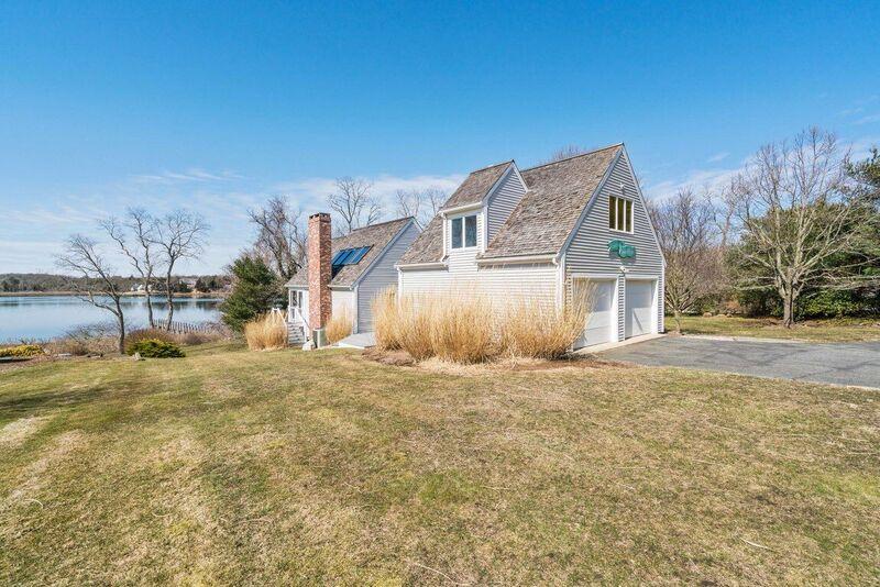 73 Barley Neck Road Orleans, MA 02653 - Photo 5 of 35 a front view of a house with a yard