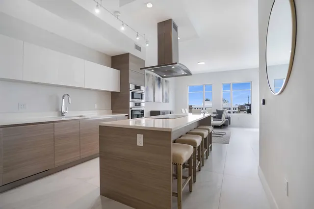 a view of a balcony with chair and floor to ceiling window