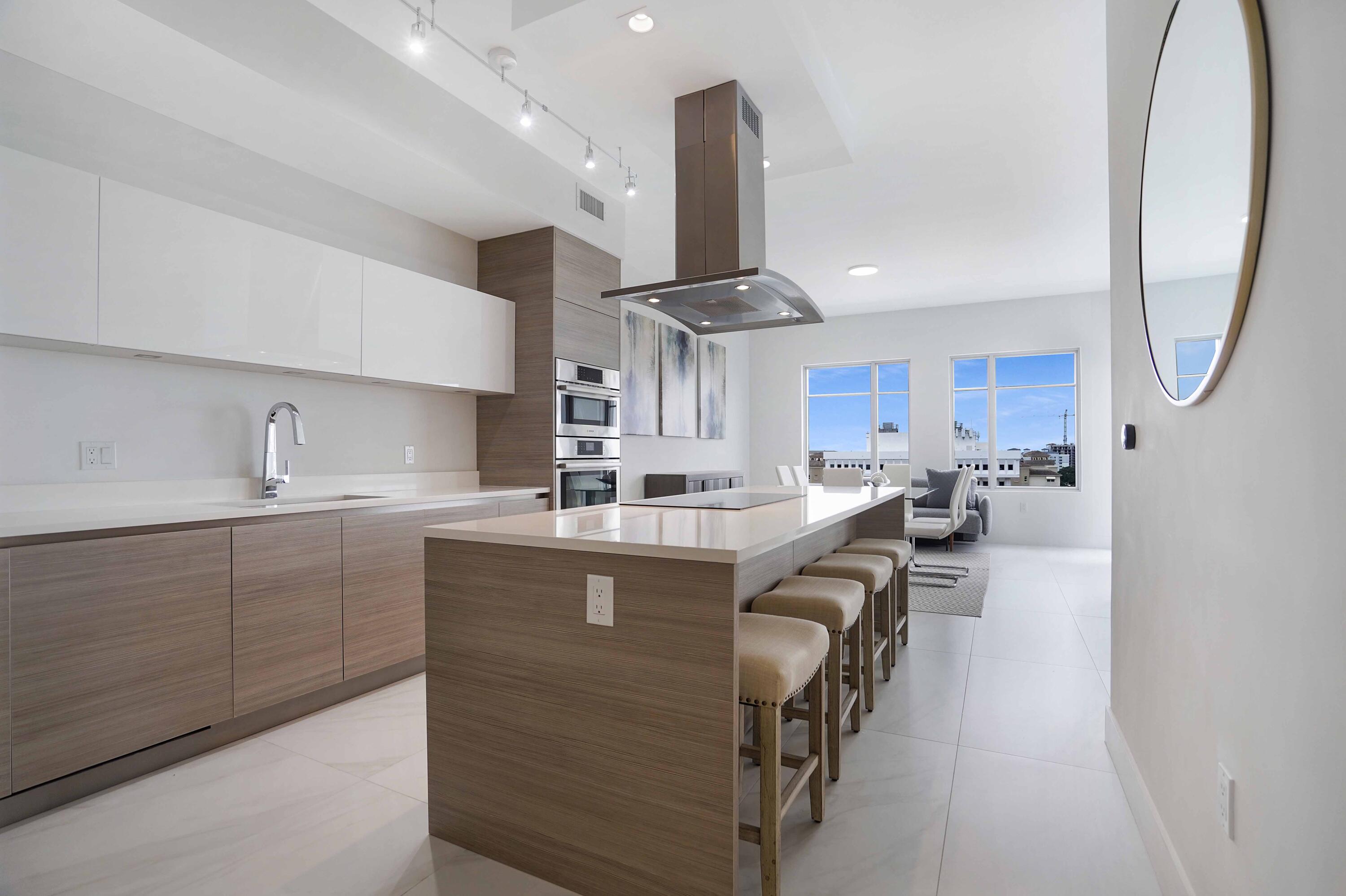 155 East Boca Raton Road, Unit 1116 Boca Raton, FL 33432 - Photo 12 of 80 a kitchen with counter top space cabinets and stainless steel appliances