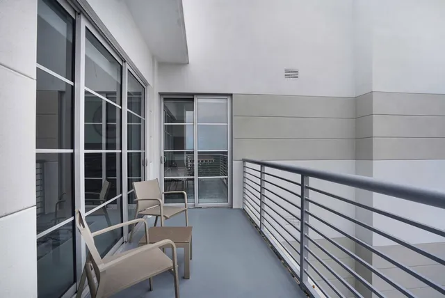 a kitchen with a table chairs refrigerator and cabinets