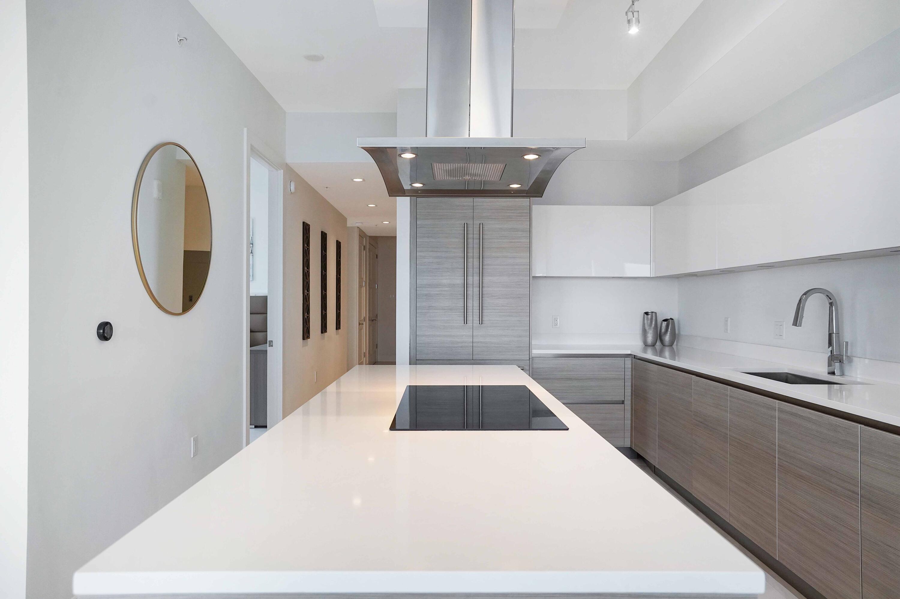 155 East Boca Raton Road, Unit 1116 Boca Raton, FL 33432 - Photo 4 of 80 a kitchen with a sink and a refrigerator