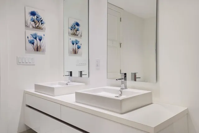 a dining room with a table and chairs