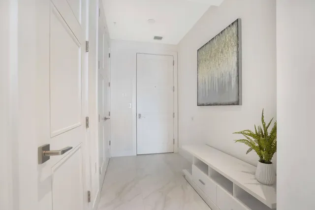 a bathroom with a glass door shower