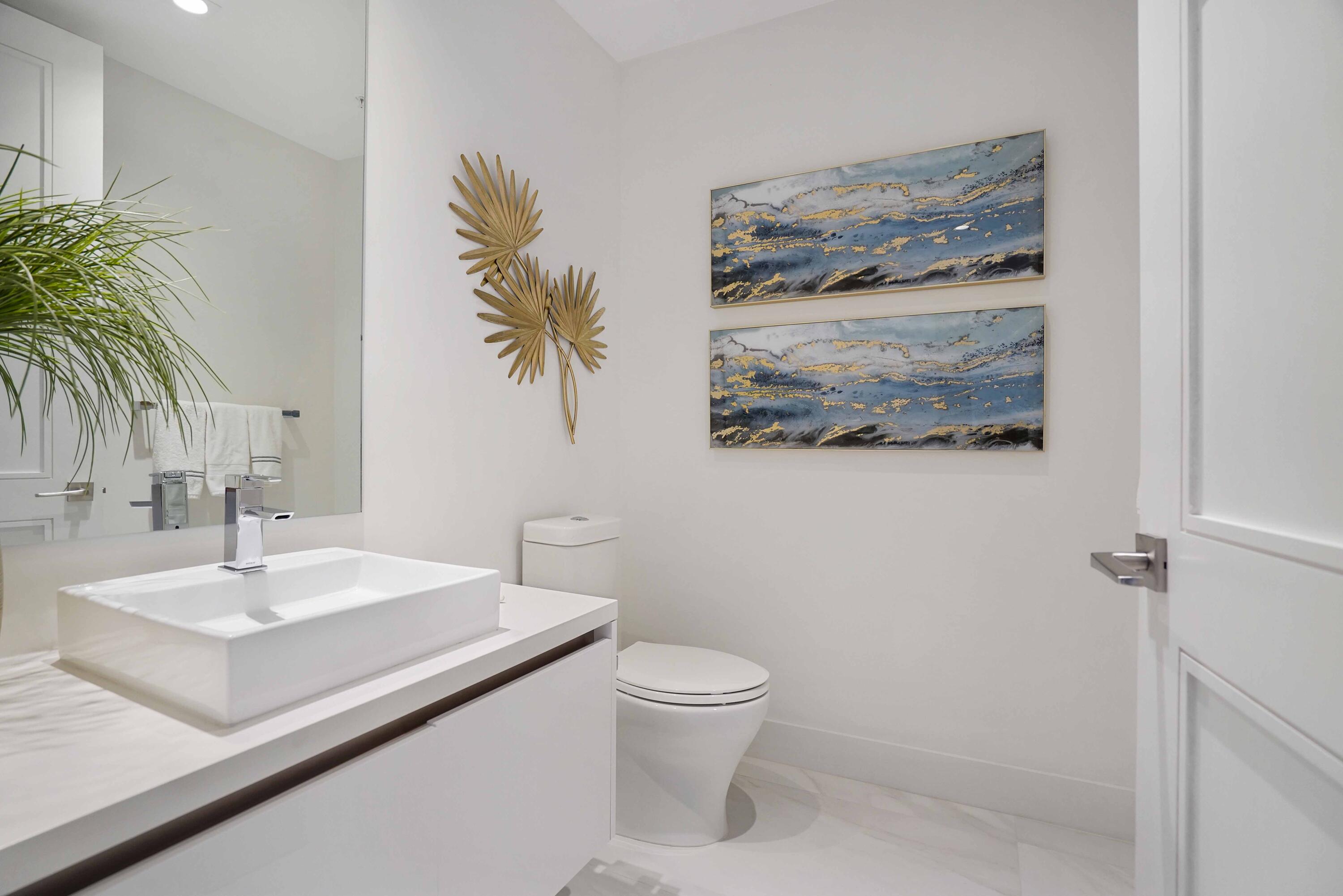 155 East Boca Raton Road, Unit 1116 Boca Raton, FL 33432 - Photo 43 of 80 a bathroom with a sink a toilet and mirror