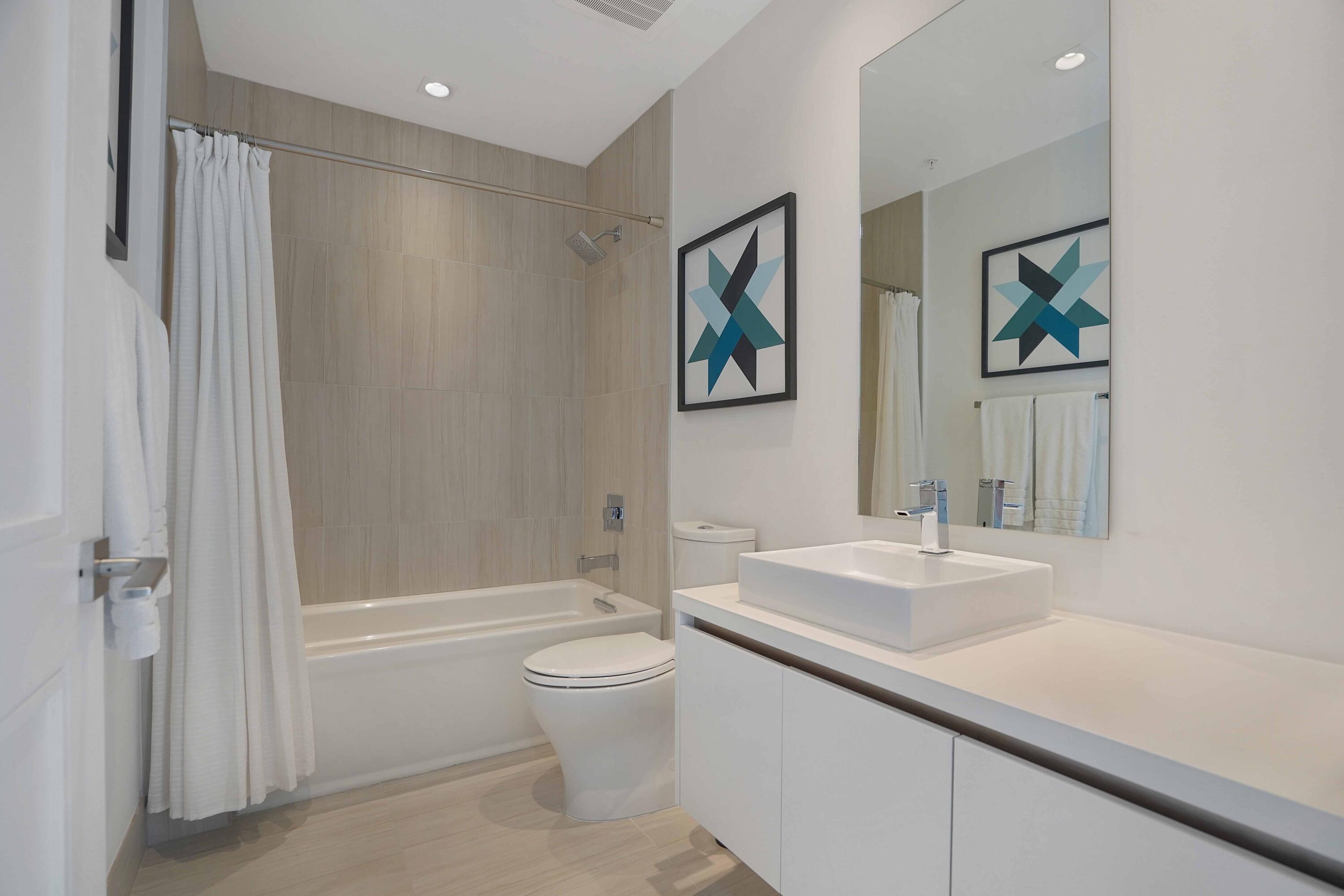 155 East Boca Raton Road, Unit 1116 Boca Raton, FL 33432 - Photo 50 of 80 a bathroom with a sink a toilet and shower