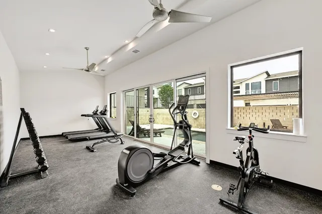 a view of a terrace with furniture and city view