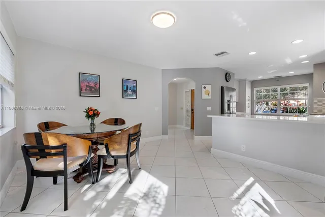 a front view of a house with a yard and a garage