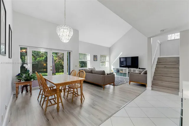 a view of a park with trees and a lake