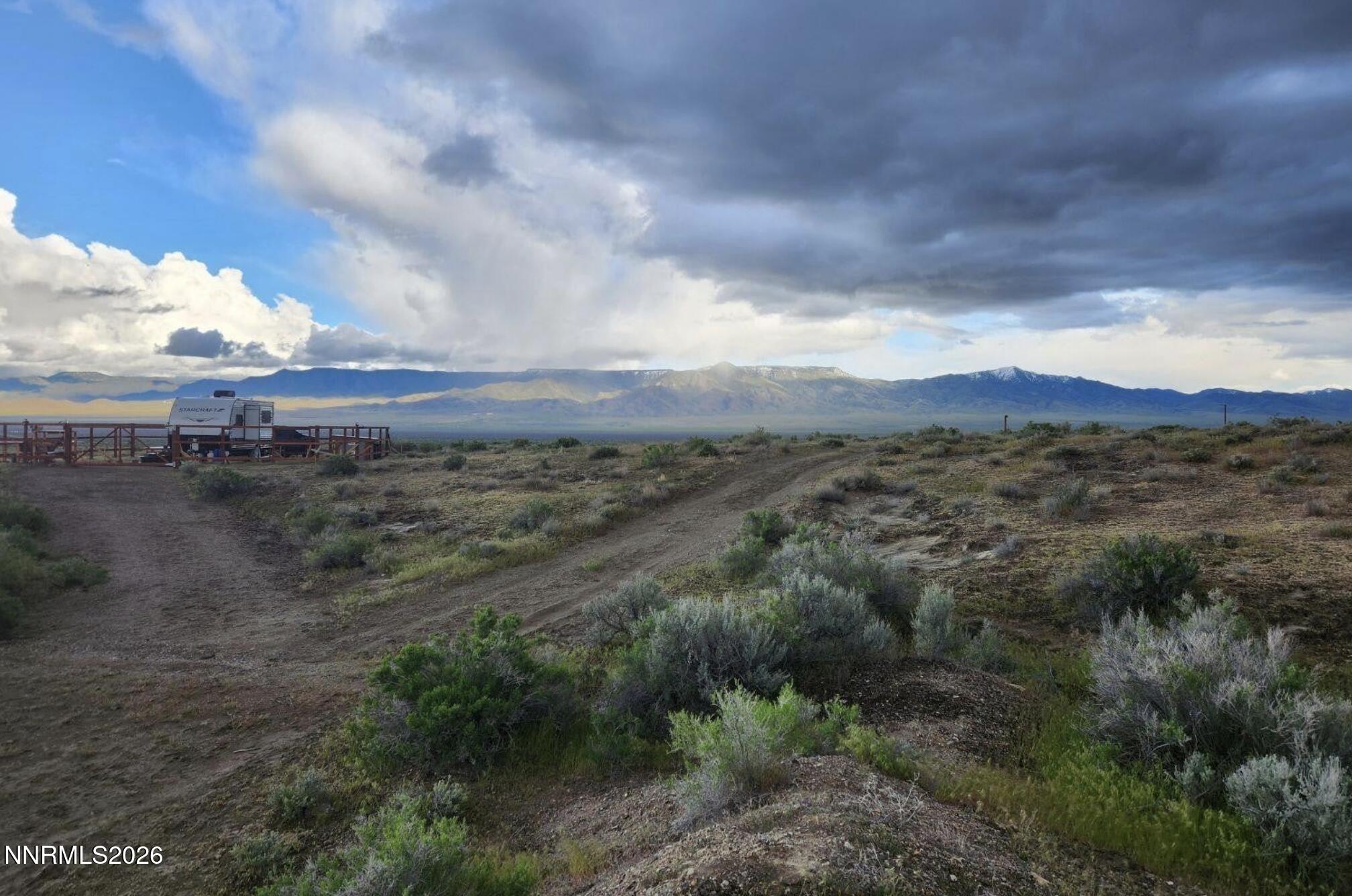 101213 Fencemaker Road Lovelock, NV 89419 - Photo 3 of 17 a view of a dry yard with lots of trees