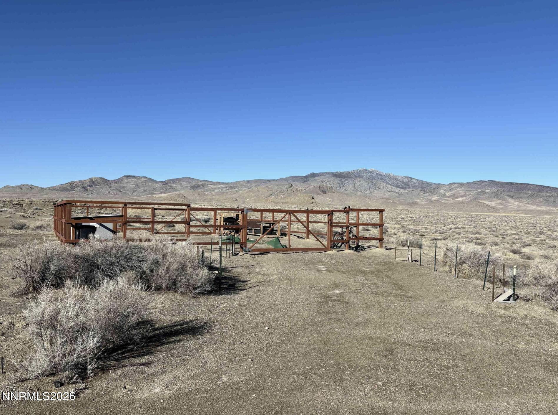 101213 Fencemaker Road Lovelock, NV 89419 - Photo 9 of 17 a view of a large building with a mountain in the background
