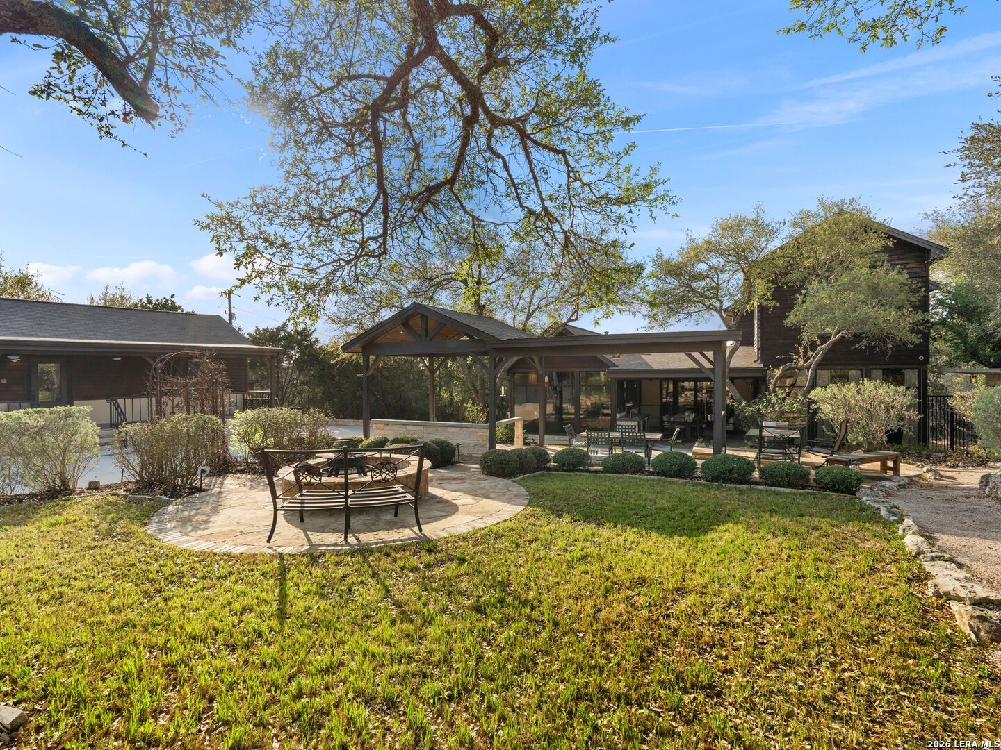 1146 Victoria Avenue Spring Branch, TX 78070 - Photo 86 of 89 a view of a house with backyard sitting area and garden