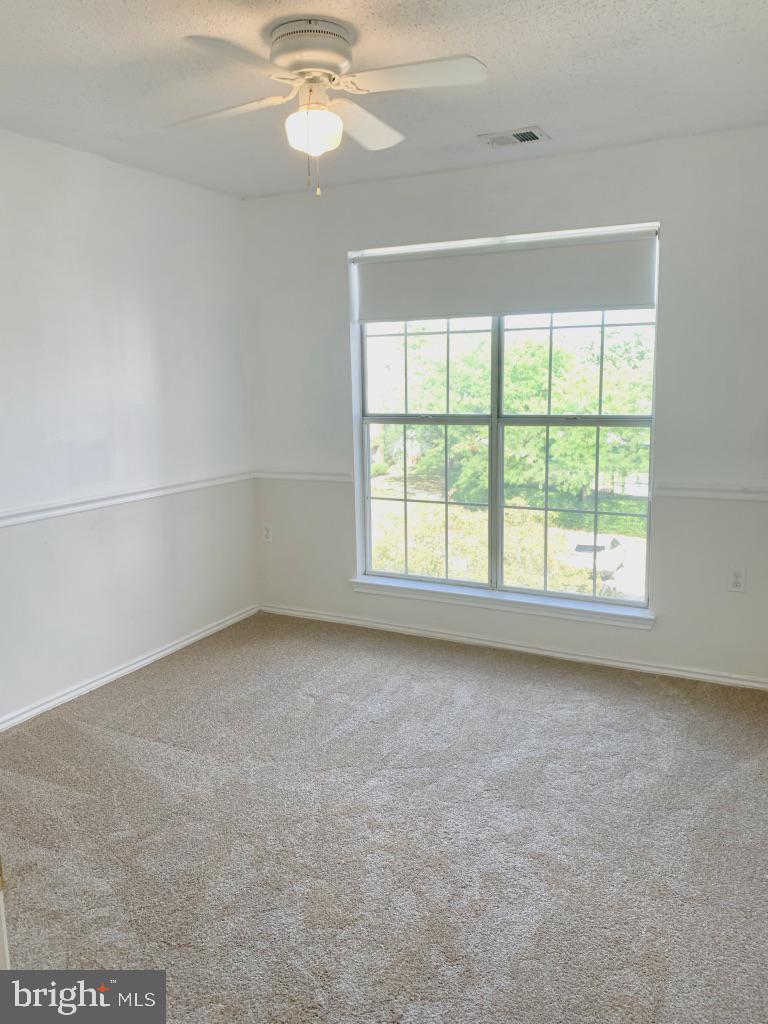 21024 Timber Ridge Terrace, Unit 302 Ashburn, VA 20147 - Photo 17 of 26 Bright and well appointed 2nd bedroom with views