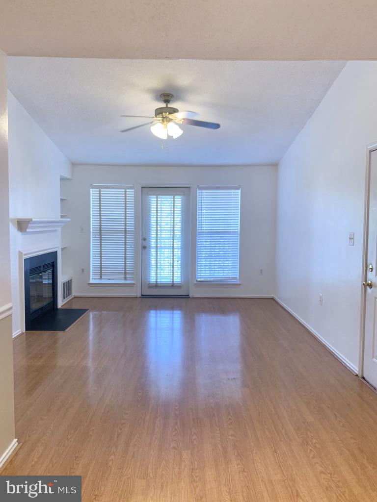 21024 Timber Ridge Terrace, Unit 302 Ashburn, VA 20147 - Photo 3 of 26 High ceilings with large balcony overlooking pool
