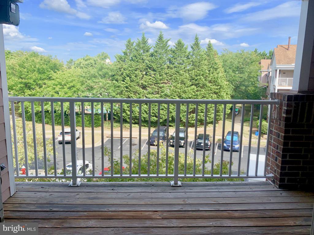 21024 Timber Ridge Terrace, Unit 302 Ashburn, VA 20147 - Photo 7 of 26 Large balcony overlooking pool and clubhouse