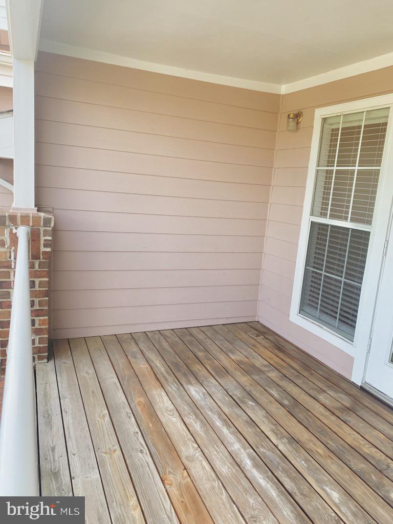 21024 Timber Ridge Terrace, Unit 302 Ashburn, VA 20147 - Photo 9 of 26 Large balcony with views of lush green & pool