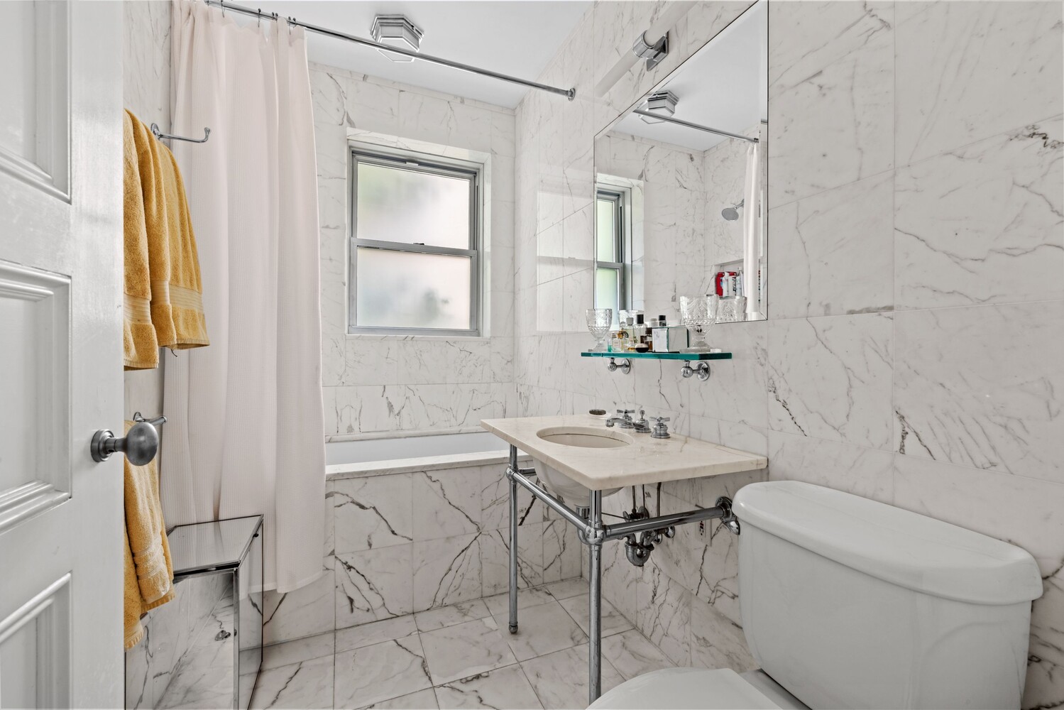 27 East 95th Street, Unit 3E Manhattan, NY 10128 - Photo 6 of 15 a bathroom with a sink toilet and shower