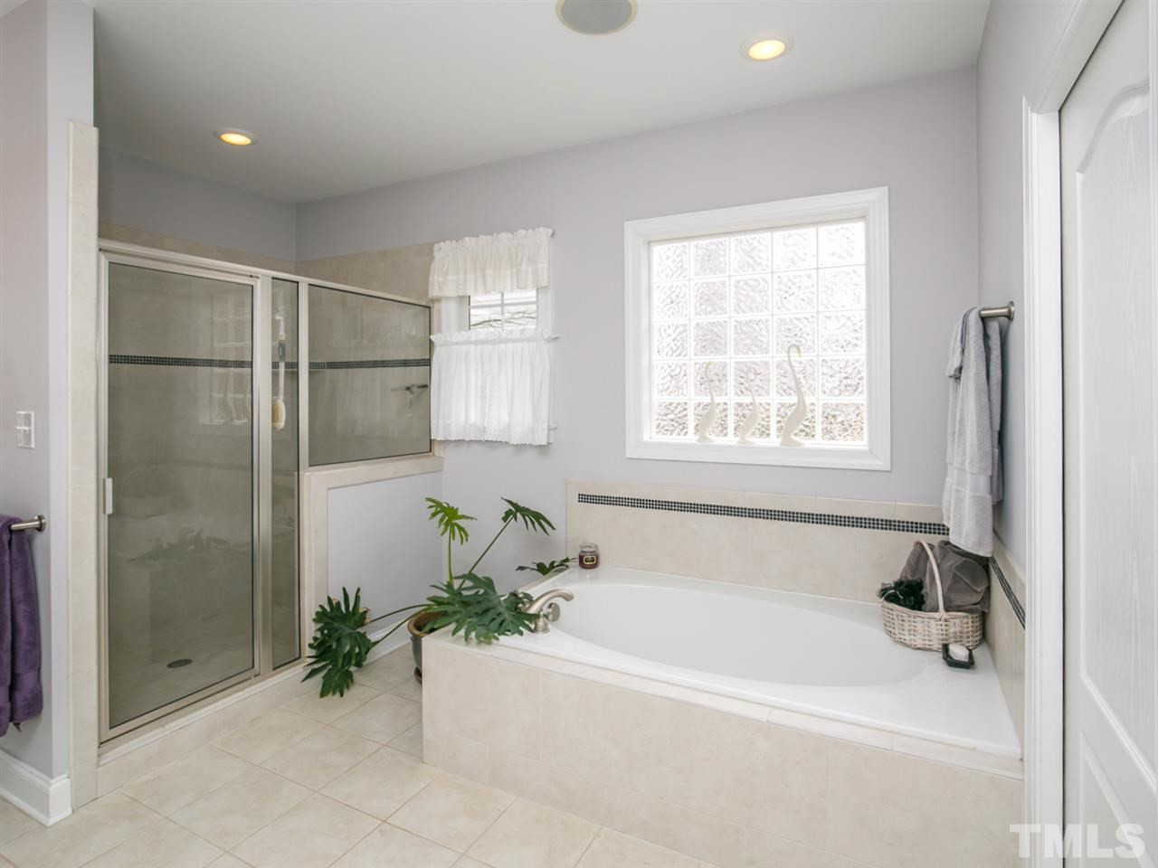 1832 Stannard Trail Raleigh, NC 27612 - Photo 13 of 25 Another view of master bath tub with shower to the left. Glass block window provides privacy but allows plenty of natural light. Master Bath/Spa