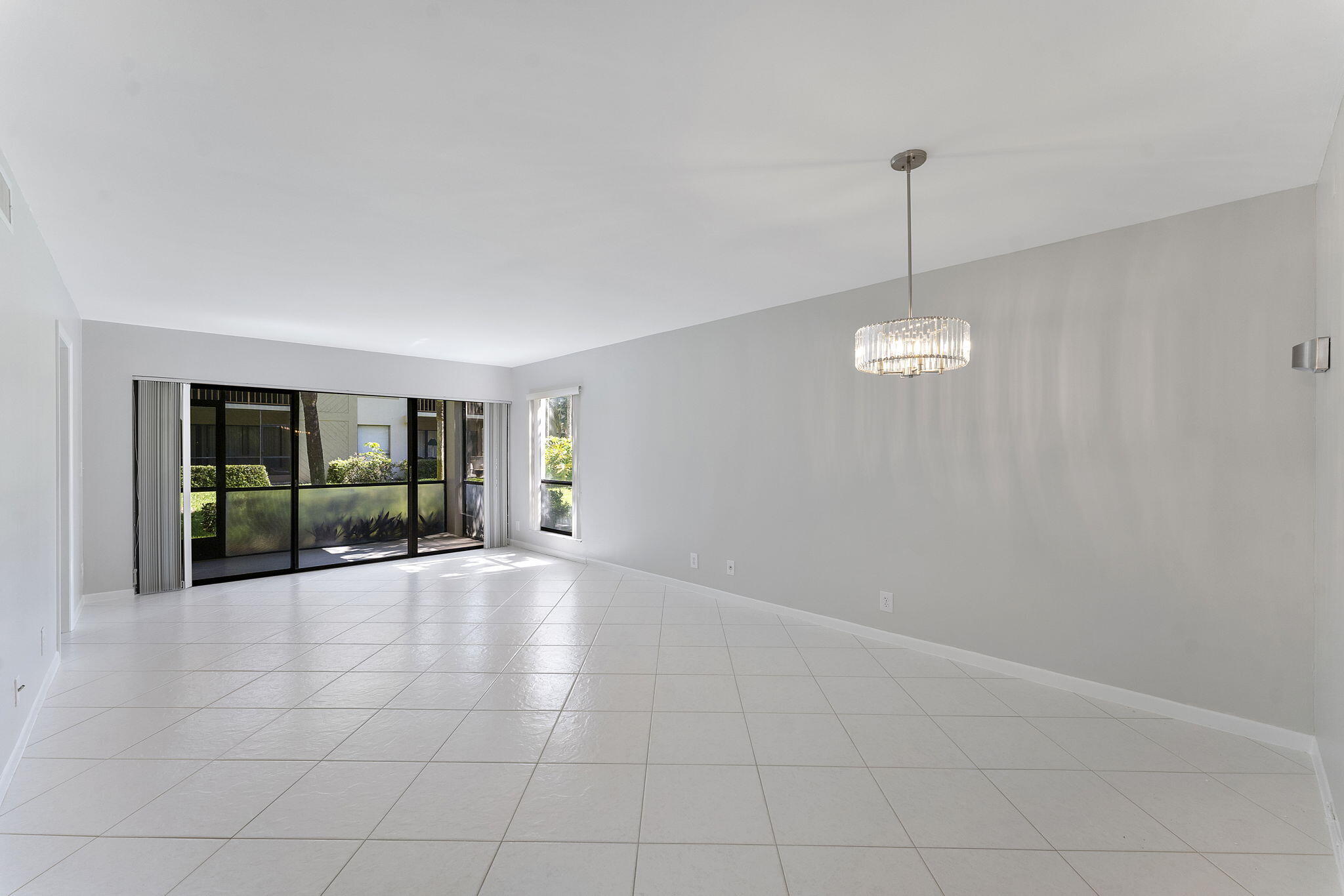 159 Northwest 70th Street, Unit 603 Boca Raton, FL 33487 - Photo 11 of 35 a view of empty room with windows
