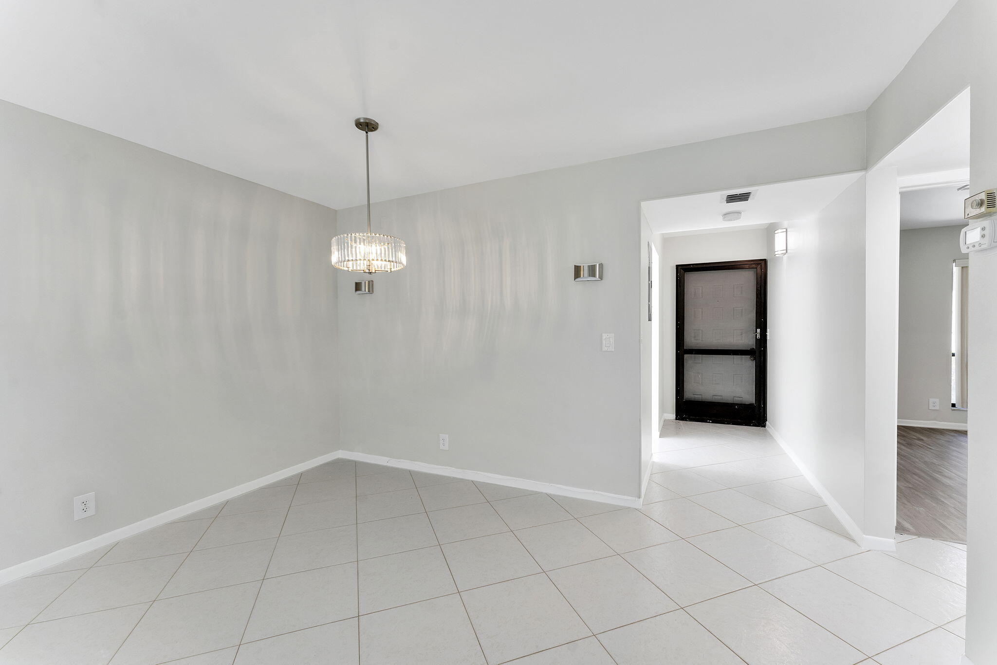 159 Northwest 70th Street, Unit 603 Boca Raton, FL 33487 - Photo 12 of 35 wooden floor in an empty room