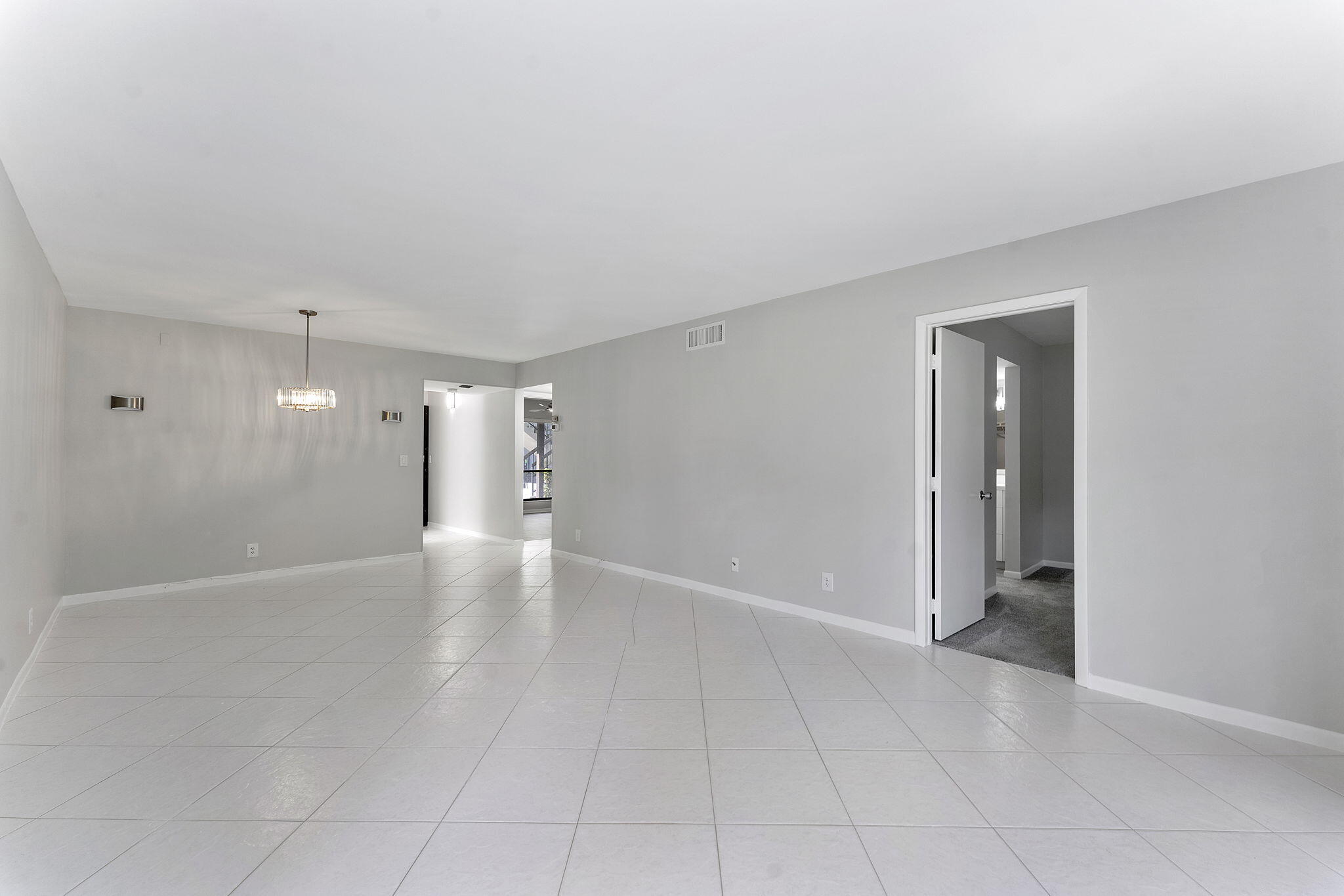 159 Northwest 70th Street, Unit 603 Boca Raton, FL 33487 - Photo 13 of 35 a view of an empty room with glass door