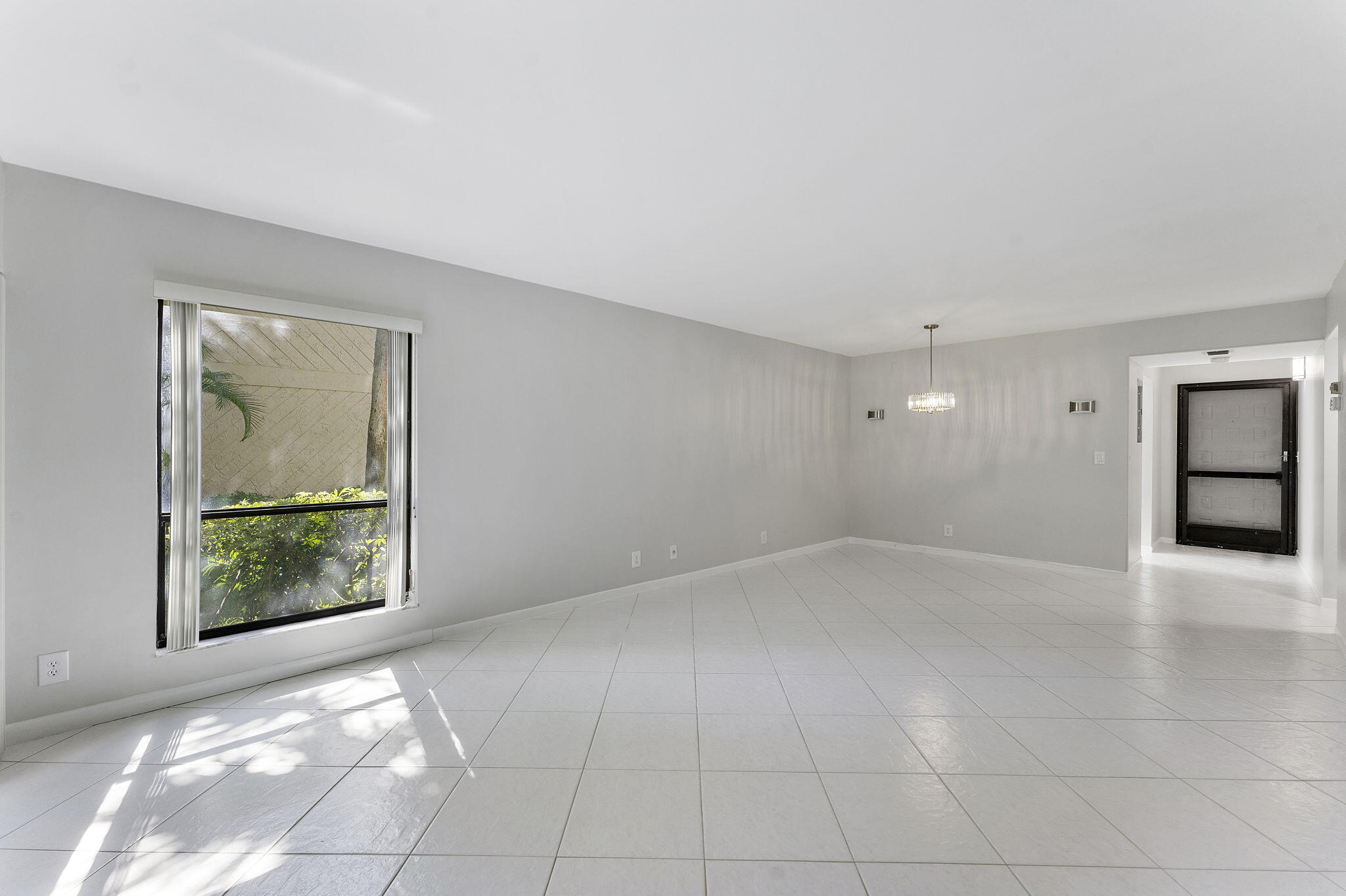 159 Northwest 70th Street, Unit 603 Boca Raton, FL 33487 - Photo 14 of 35 an empty room with windows and closet