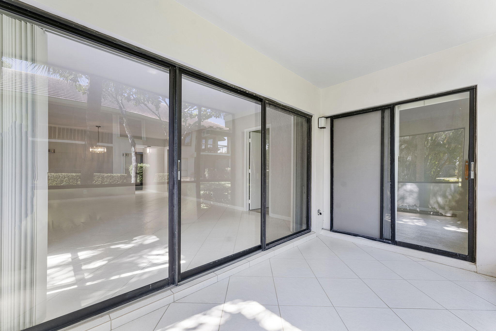 159 Northwest 70th Street, Unit 603 Boca Raton, FL 33487 - Photo 26 of 35 a view of entryway with a glass door