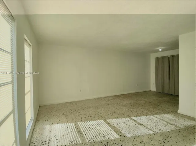 an empty room with a bench