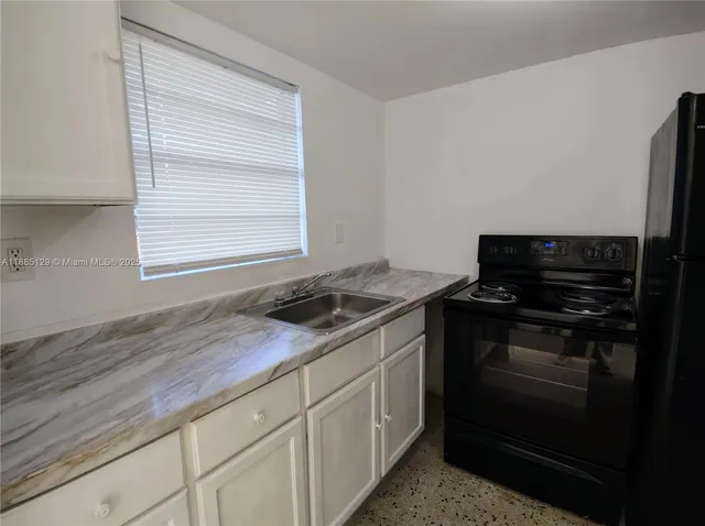a kitchen with a stove and a microwave