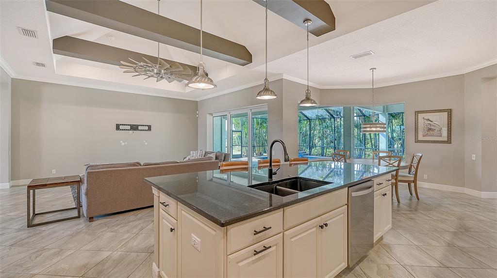318 Ragdoll Run Bradenton, FL 34212 - Photo 19 of 87 a kitchen with a stove a counter space and furniture