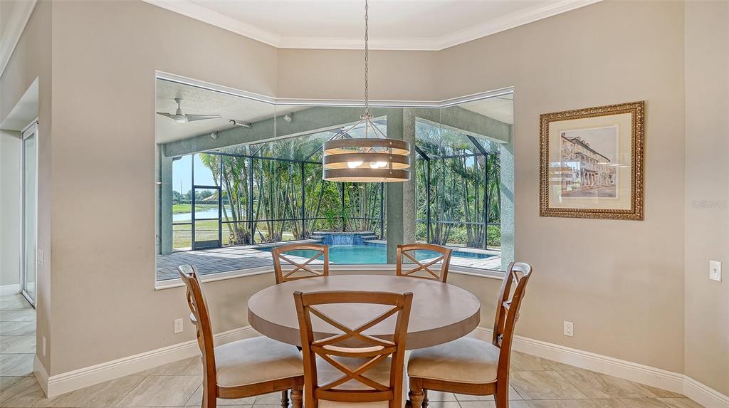 318 Ragdoll Run Bradenton, FL 34212 - Photo 22 of 87 a dining room with furniture and window