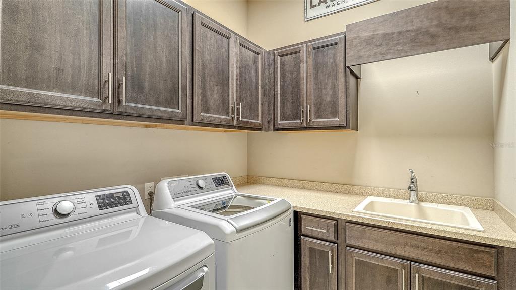318 Ragdoll Run Bradenton, FL 34212 - Photo 24 of 87 a utility room with dryer and washer
