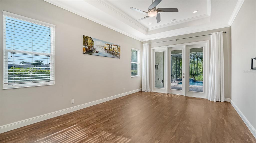 318 Ragdoll Run Bradenton, FL 34212 - Photo 25 of 87 a view of an empty room with wooden floor and a window