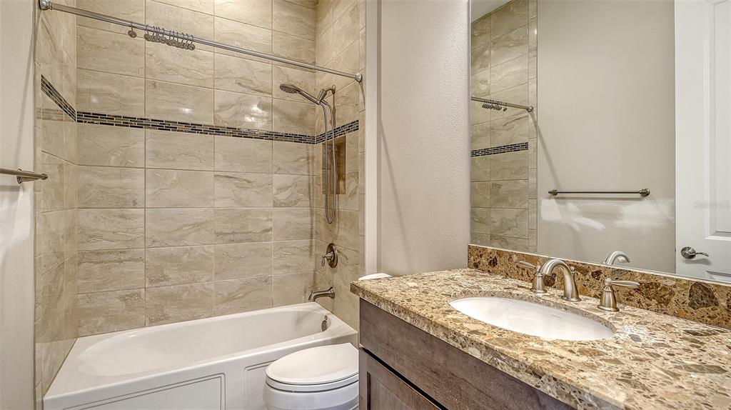 318 Ragdoll Run Bradenton, FL 34212 - Photo 33 of 87 a bathroom with a granite countertop bathtub shower sink vanity and toilet