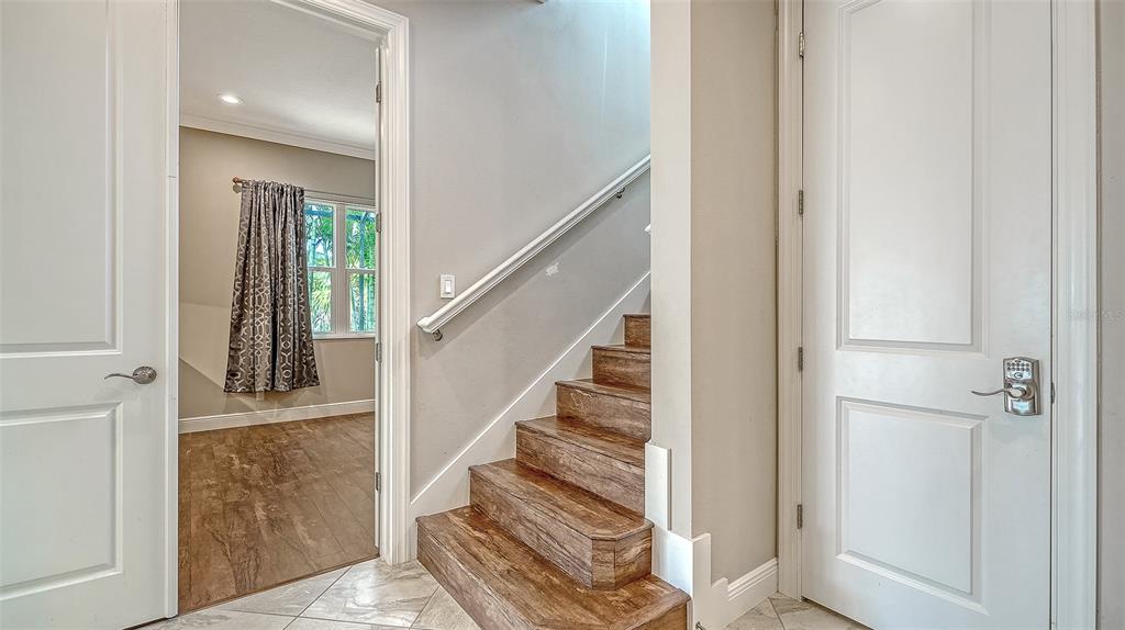 318 Ragdoll Run Bradenton, FL 34212 - Photo 37 of 87 a view of entryway with wooden floor and stairs