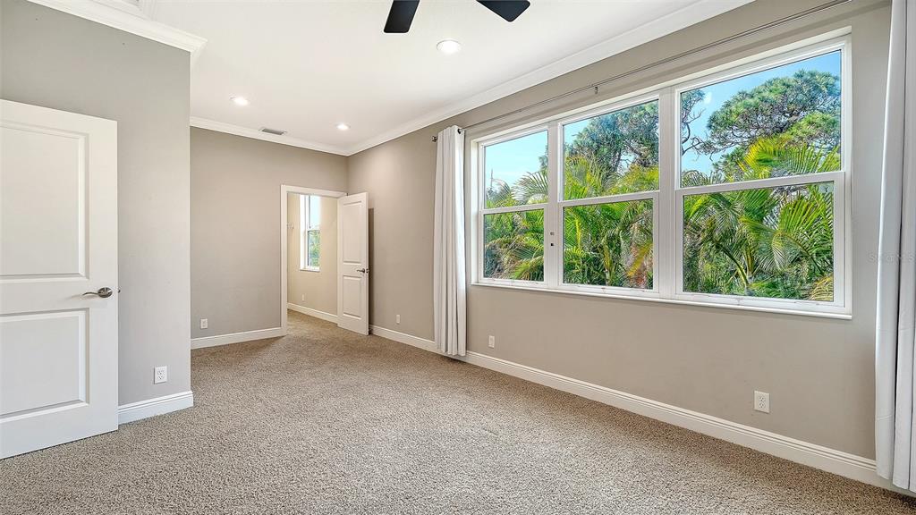318 Ragdoll Run Bradenton, FL 34212 - Photo 42 of 87 wooden floor in an empty room with a window