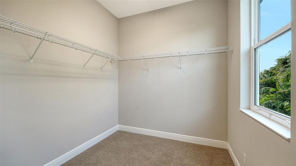 318 Ragdoll Run Bradenton, FL 34212 - Photo 44 of 87 a view of a room with racks on the wall