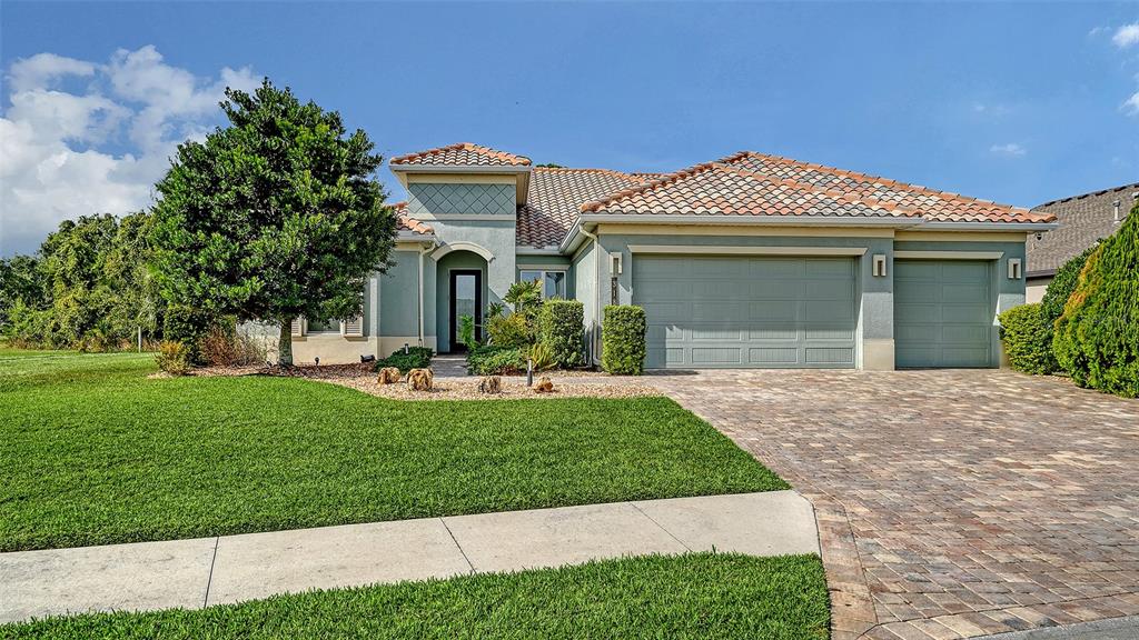 318 Ragdoll Run Bradenton, FL 34212 - Photo 5 of 87 a front view of a house with a yard