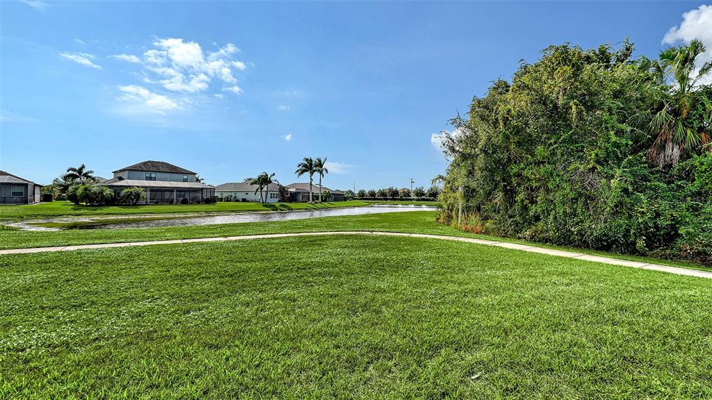 318 Ragdoll Run Bradenton, FL 34212 - Photo 58 of 87 a view of a golf course with a lake