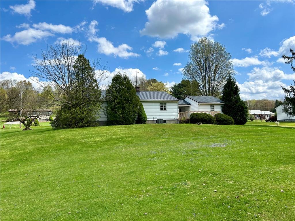 23 Paxton Road Sandy Lake, PA 16145 - Photo 6 of 25 a front view of a house with a yard