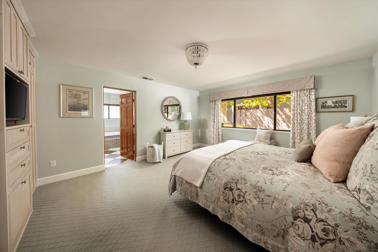 1213 San Ramon Way Ojai, CA 93023 - Photo 15 of 35 a bedroom with a bed and a flat tv screen on dresser