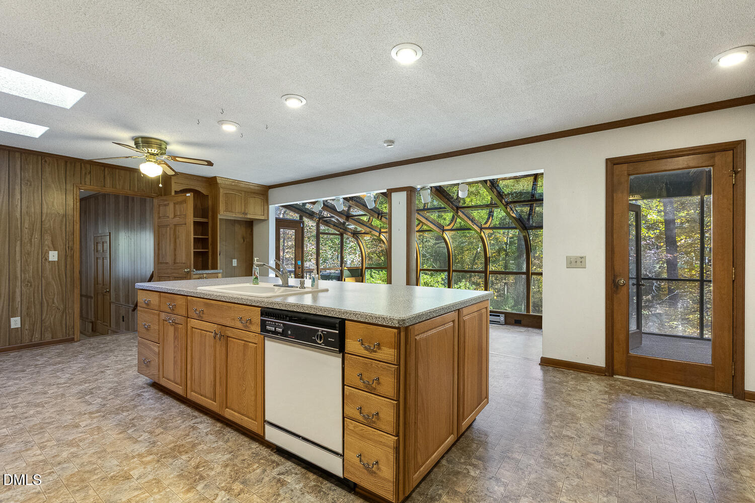 3028 Ethan Lane Raleigh, NC 27613 - Photo 12 of 58 a kitchen with stainless steel appliances granite countertop a stove and a large window