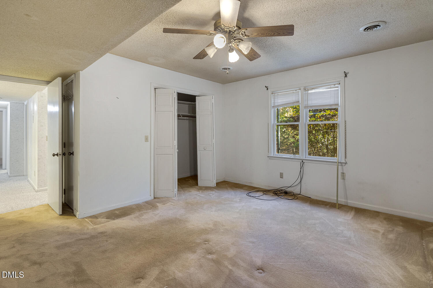 3028 Ethan Lane Raleigh, NC 27613 - Photo 31 of 58 an empty room with windows and fan