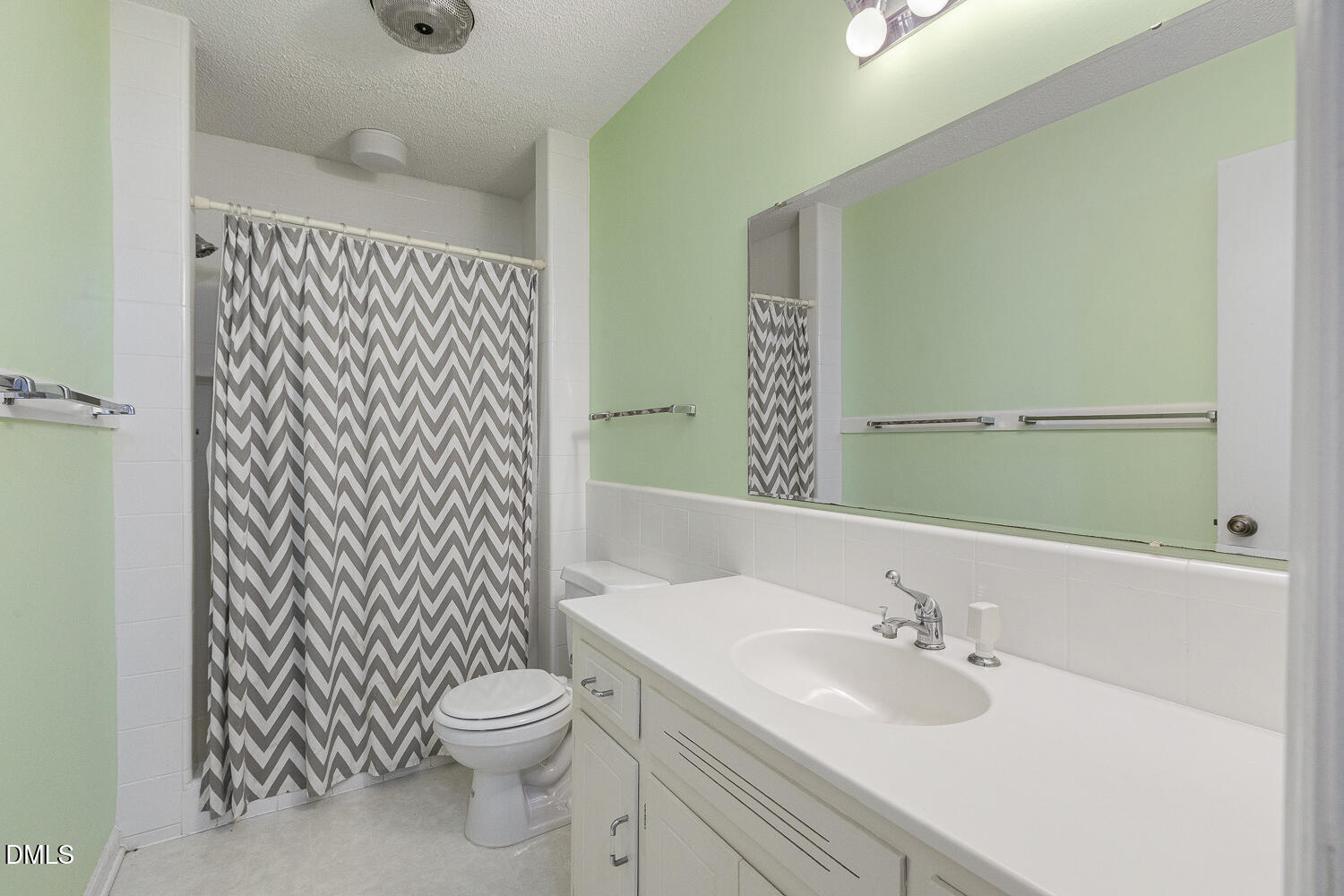 3028 Ethan Lane Raleigh, NC 27613 - Photo 34 of 58 a bathroom with a granite countertop sink toilet and mirror