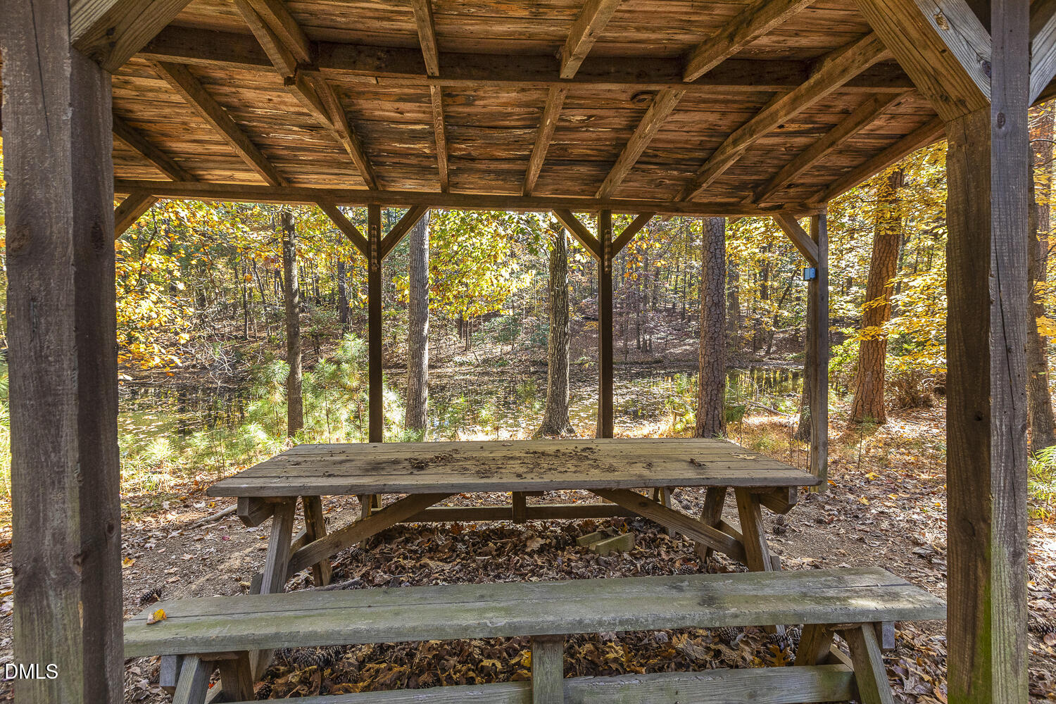 3028 Ethan Lane Raleigh, NC 27613 - Photo 49 of 58 a view of a patio with a wooden table and chairs