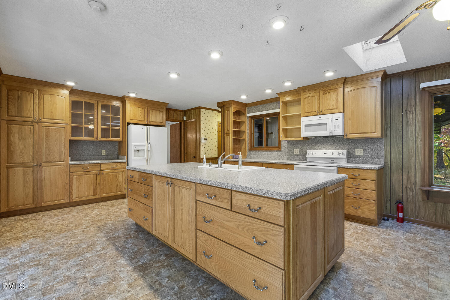 3028 Ethan Lane Raleigh, NC 27613 - Photo 4 of 58 a kitchen with granite countertop a sink and cabinets