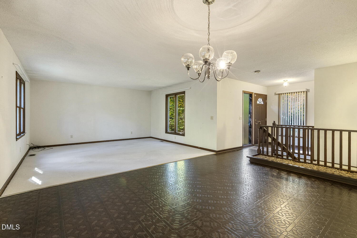 3028 Ethan Lane Raleigh, NC 27613 - Photo 8 of 58 a view of a livingroom with wooden floor and a ceiling fan
