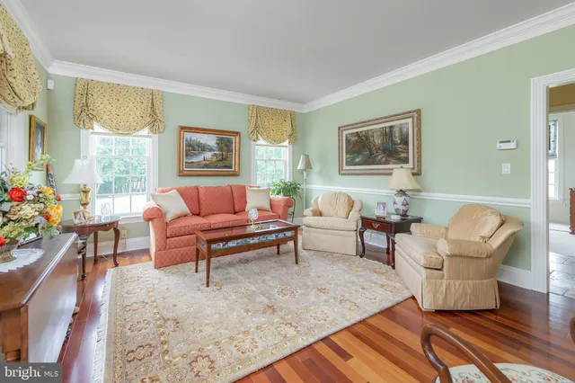 a kitchen with stainless steel appliances granite countertop a kitchen island a table and chairs